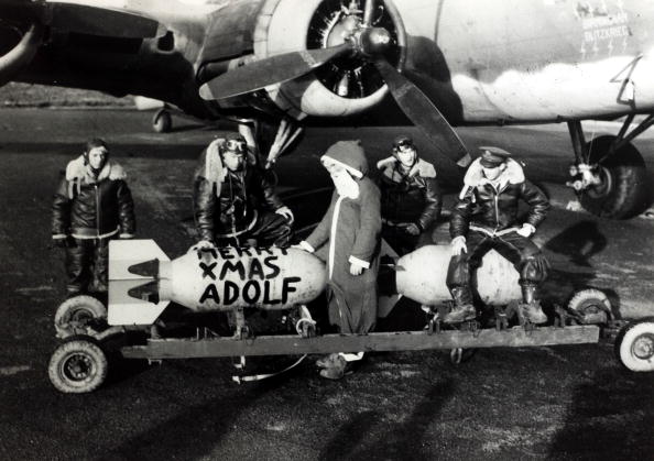 War and Conflict. World War Two. pic: November 1942. A Boeing B-17 "Flying Fortress" crew planning a Christmas present for Aldolf Hitler with a bomb adressed to him. The "Flying Fortress" first flew in 1935 and was the most famous American bomber of World